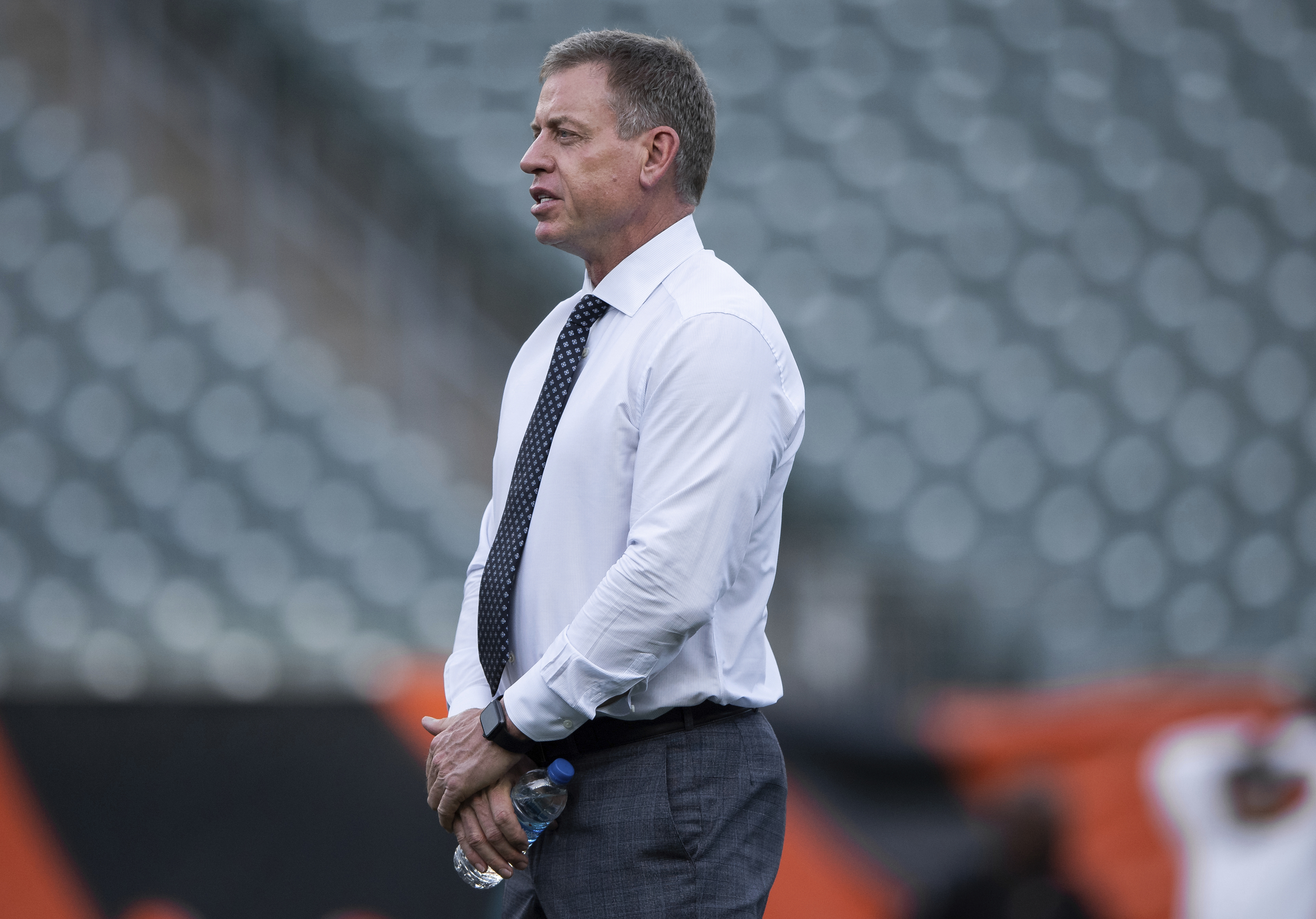 Troy Aikman stands on the field before a game between the Jacksonville Jaguars and the Cincinnati Bengals on Sept. 30, 2021, in Cincinnati. (Zach Bolinger/AP)
