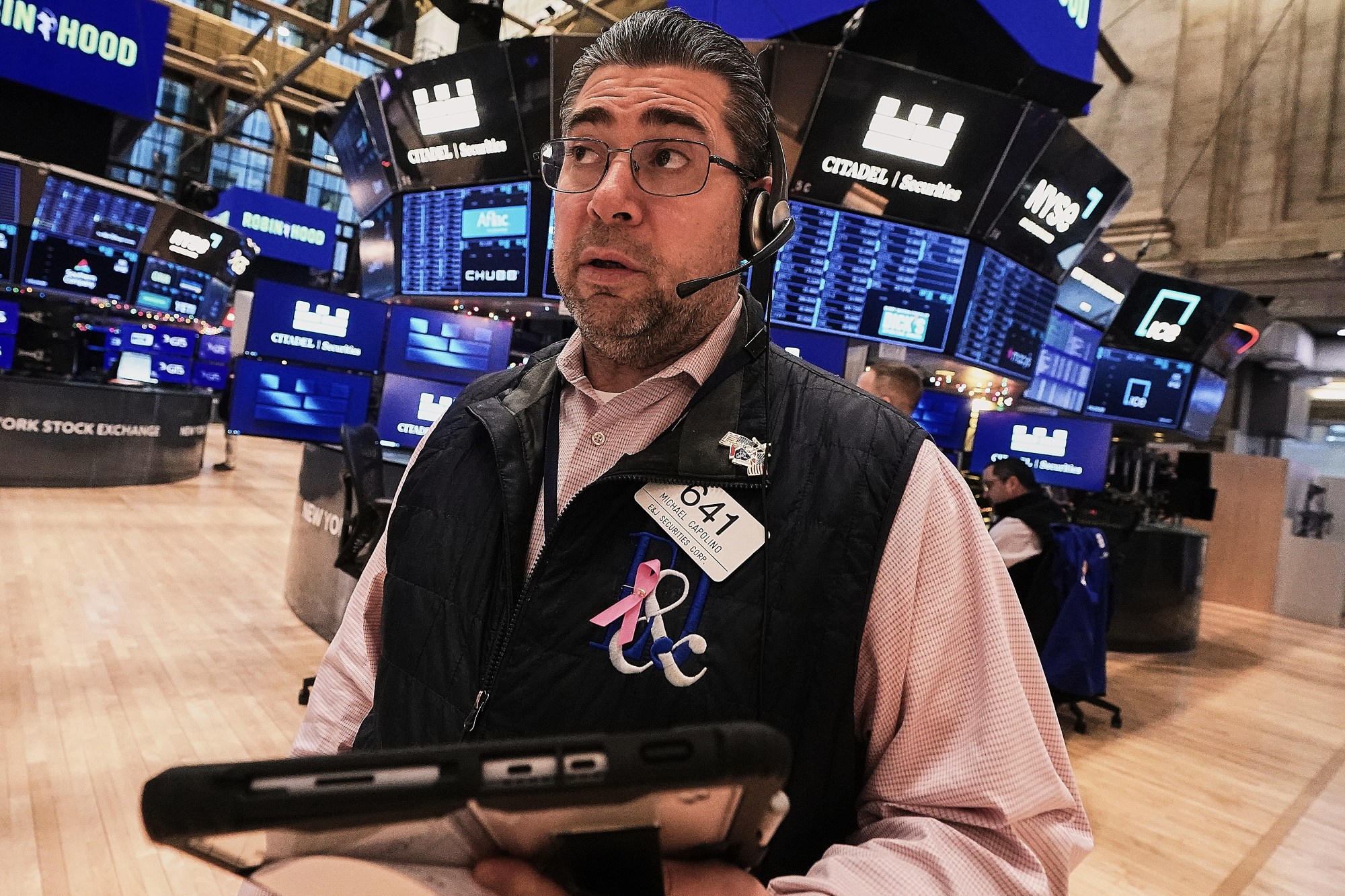 Trader Michael Capolino works on the floor of the New York Stock Exchange