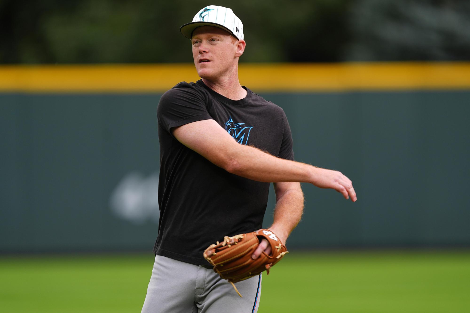 FILE – Miami Marlins first baseman Eric Wagaman (33) warms up before a baseball game Wednesday, Sept. 17, 2025, in Denver. (AP Photo/David Zalubowski, File)
