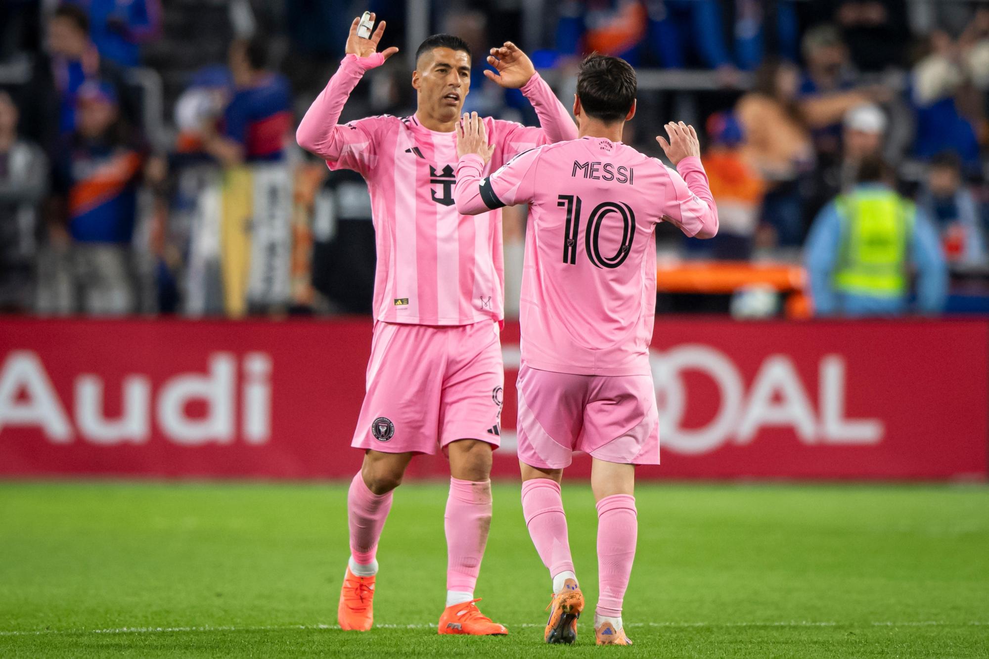 Inter Miami forward Lionel Messi (10) celebrates with forward Luis Suárez (9) after beating FC Cincinnati during the MLS soccer’s Eastern Conference semifinal Sunday, Nov. 23, 2025, in Cincinnati. (AP Photo/Tanner Pearson)
