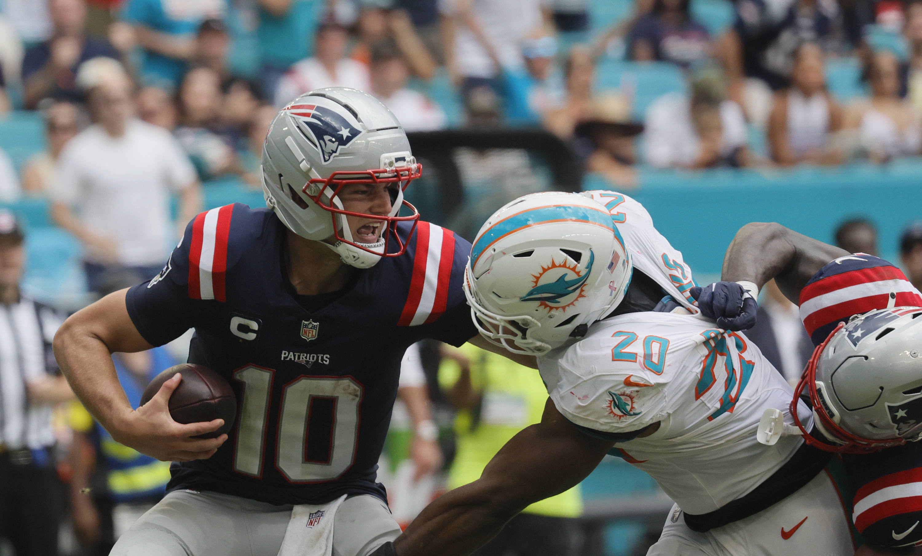 Patriots QB Drake Maye is sacked by Dolphins LB Jordyn Brooks on Sept. 14, 2025 at Hard Rock Stadium in Miami Gardens. (Joe Cavaretta/South Florida Sun Sentinel)