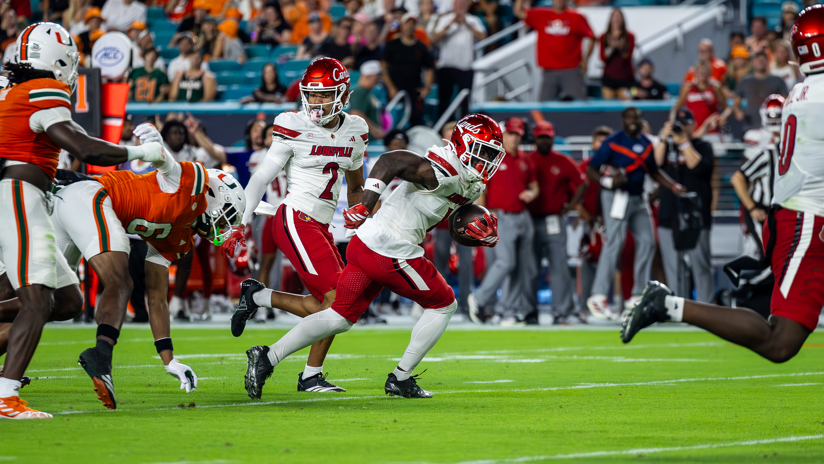 Louisville running back Isaac Brown runs the ball downfield against the Miami Hurricanes defense at Hard Rock Stadium on Friday, Oct. 17, 2025. (Keira Arimenta/Contributor)